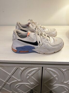 Nike White Sneakers with Black Swoosh and Blue-Orange Midsole Accents